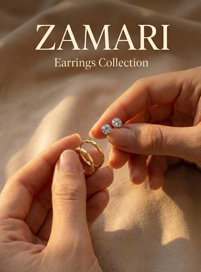 Canadian dainty Sterling silver and 18k gold vermeil earrings from Zamari collection held in hands