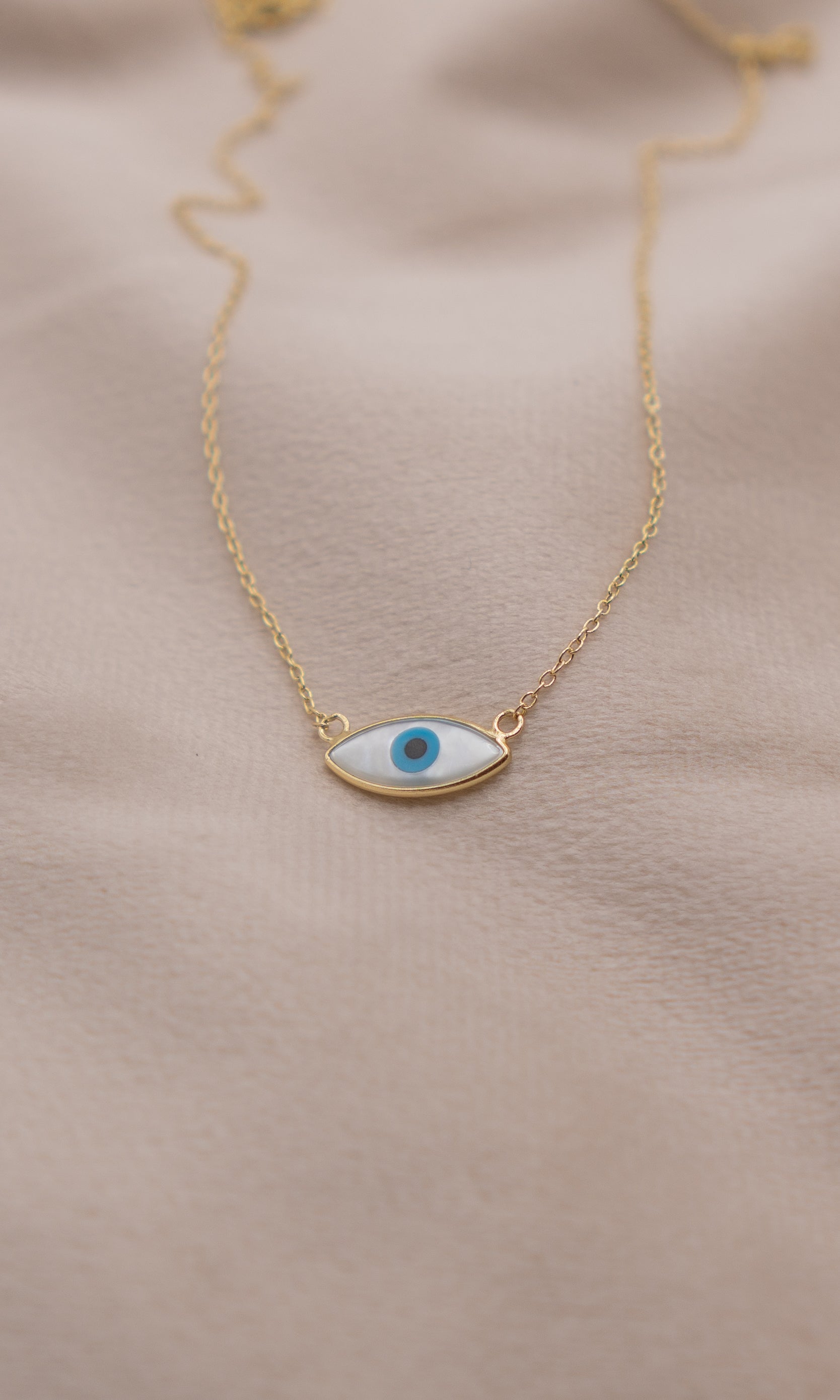 Zamari gold chain necklace with blue evil eye pendant from online dainty jewelry boutique