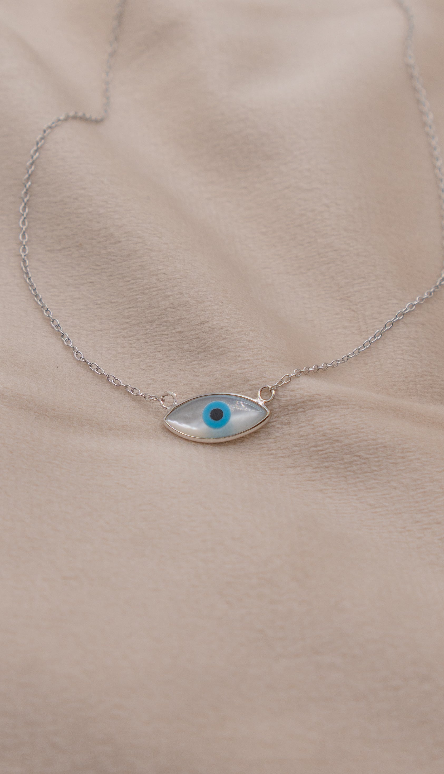 Zamari delicate silver necklace with blue eye pendant from online dainty jewelry boutique