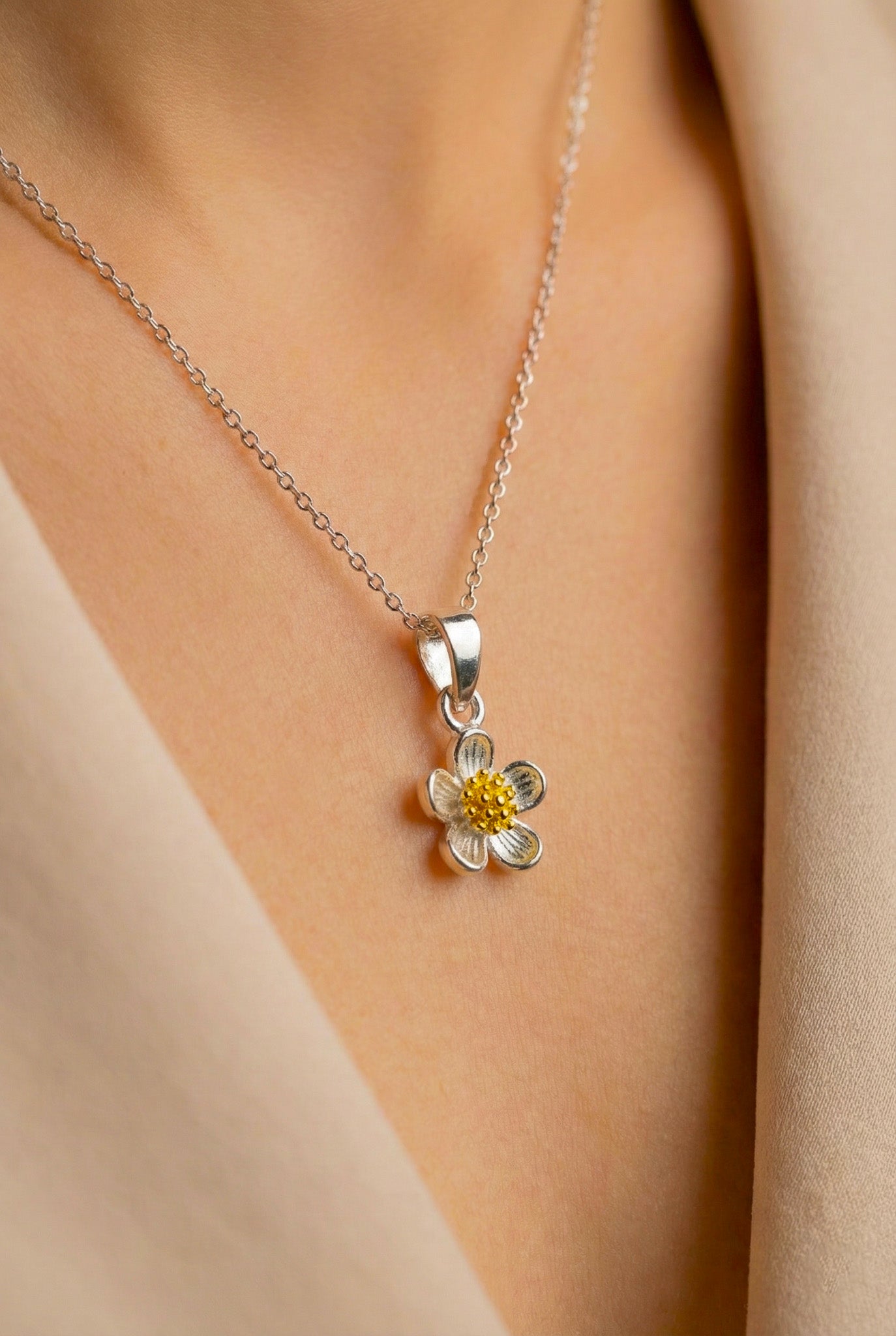 Zamari silver flower necklace with yellow center from online dainty jewelry boutique