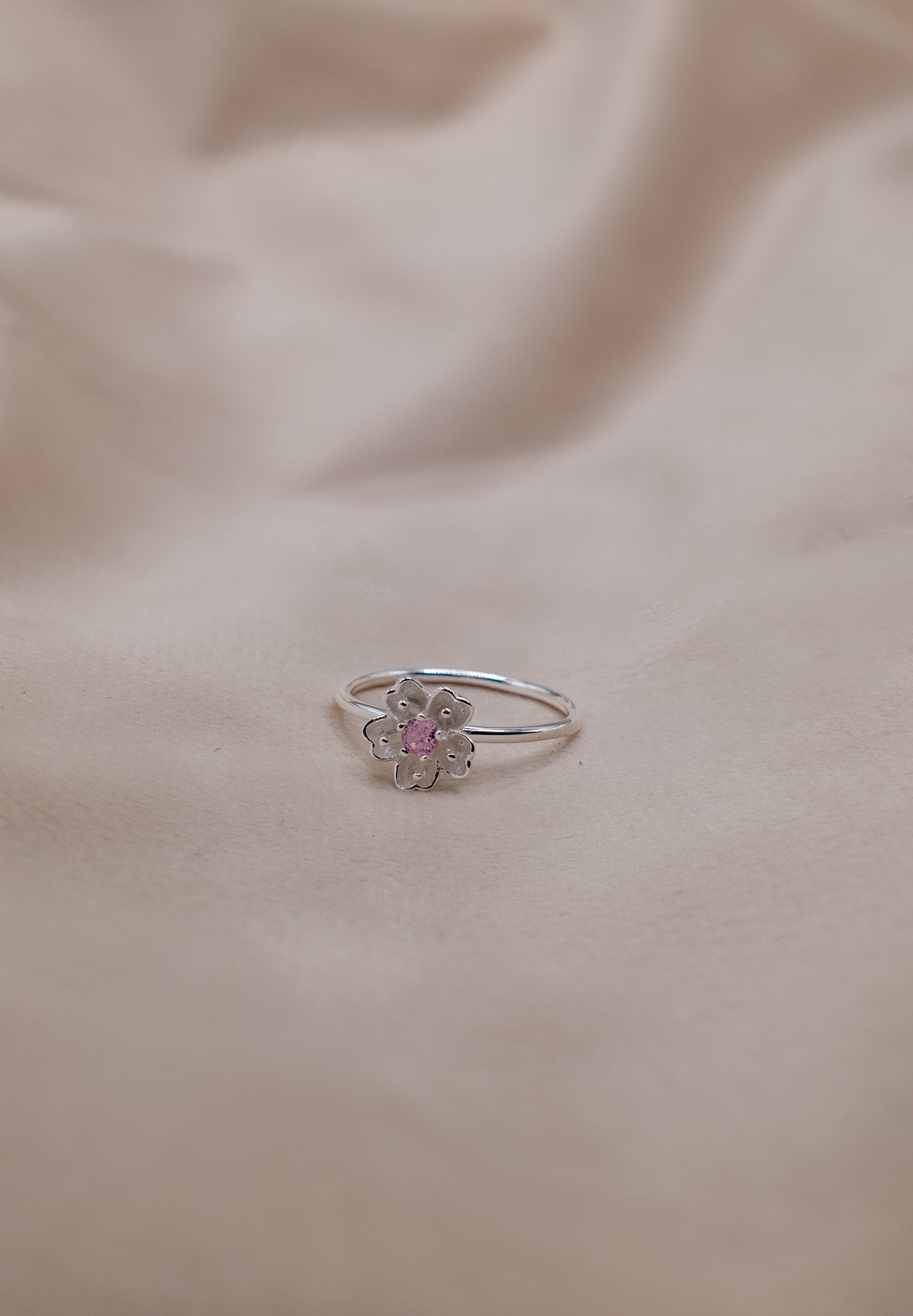 Zamari silver flower ring with pink center gemstone from online dainty jewelry boutique