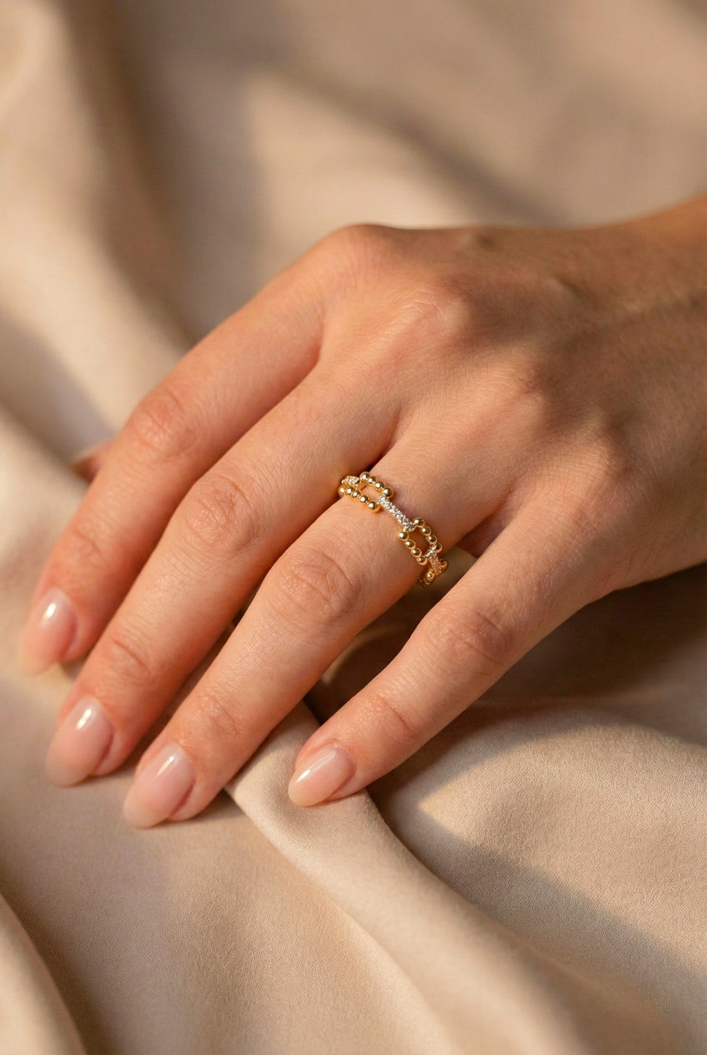 Zamari gold ring on hand from online dainty jewelry boutique featuring delicate chain design