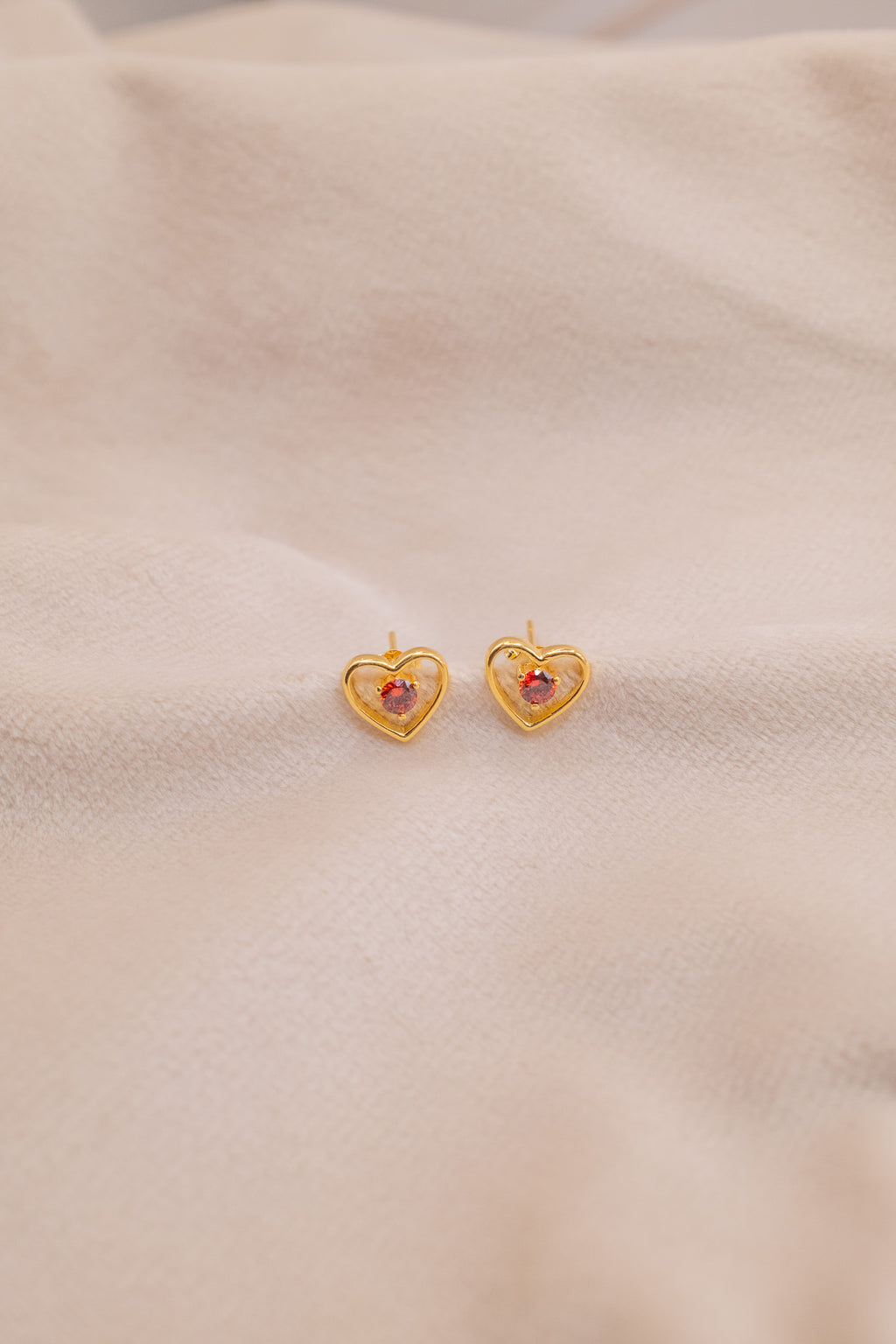 Zamari gold heart-shaped earrings with red stone from online dainty jewelry boutique collection