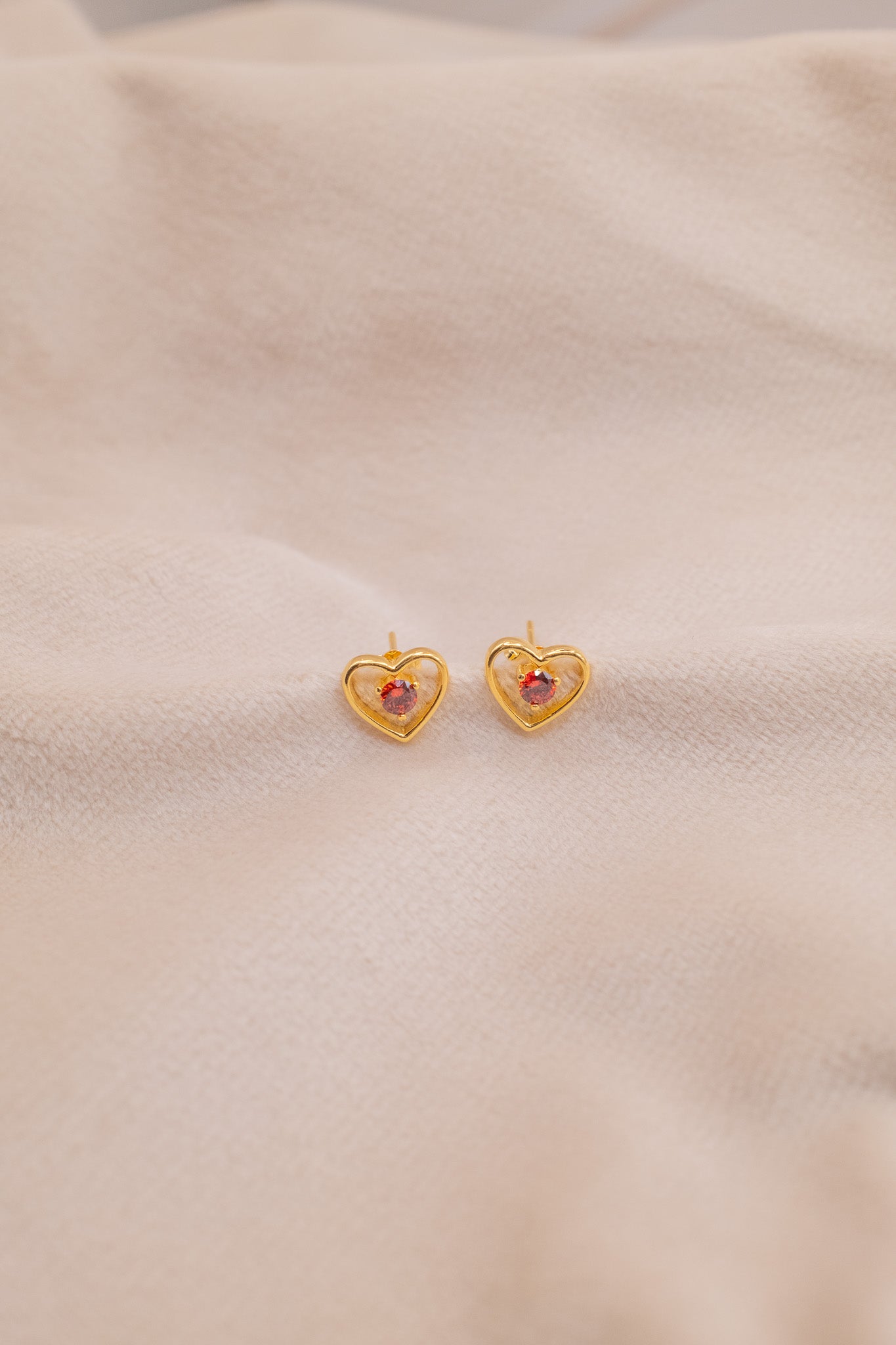 Zamari gold heart-shaped earrings with red stone from online dainty jewelry boutique collection