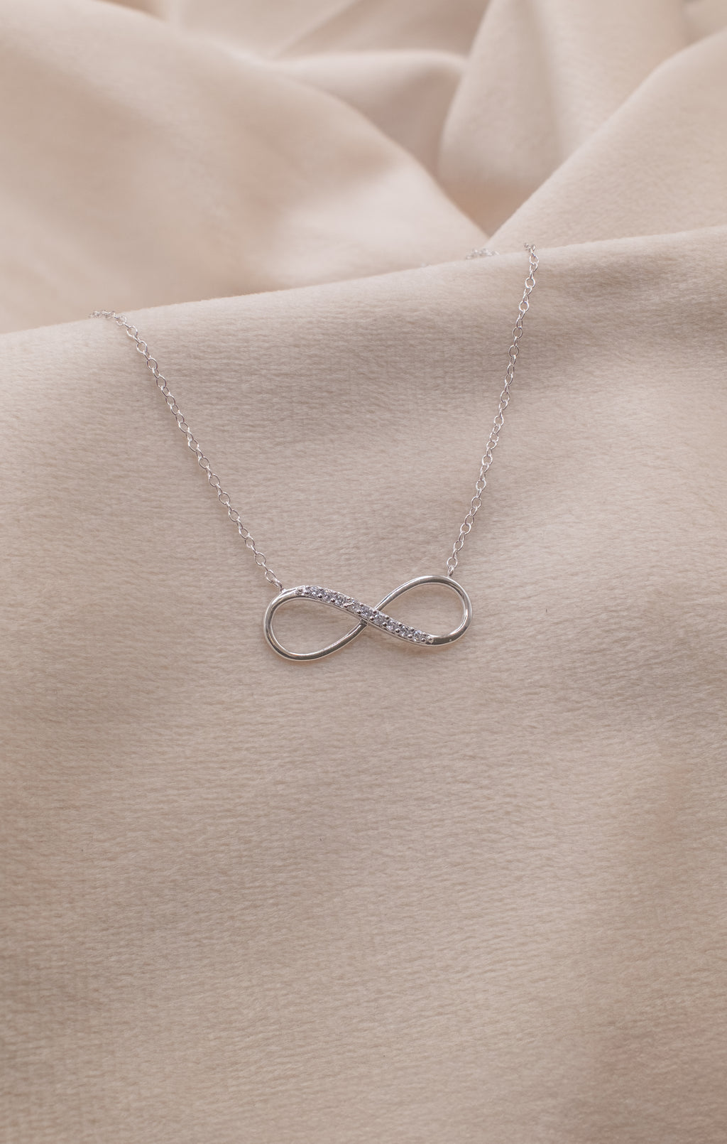 Silver infinity necklace with delicate chain from Zamari online dainty jewelry boutique
