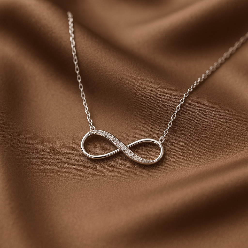 Zamari infinity necklace with small diamonds displayed on brown fabric from online dainty jewelry boutique