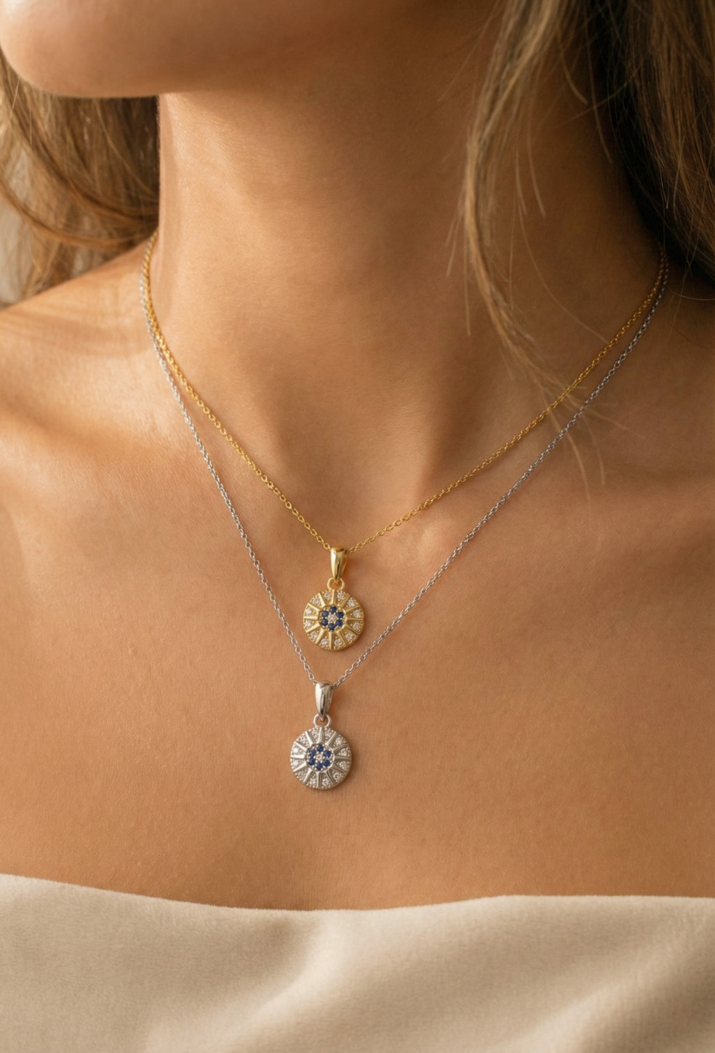 Zamari layered gold and silver necklaces with sunburst pendants from online dainty jewelry boutique