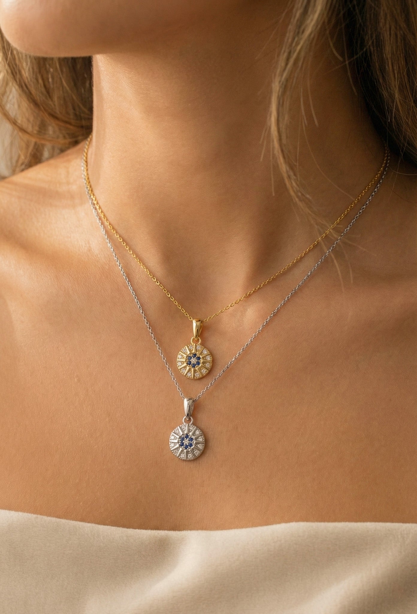 Zamari layered gold and silver necklaces with sunburst pendants from online dainty jewelry boutique